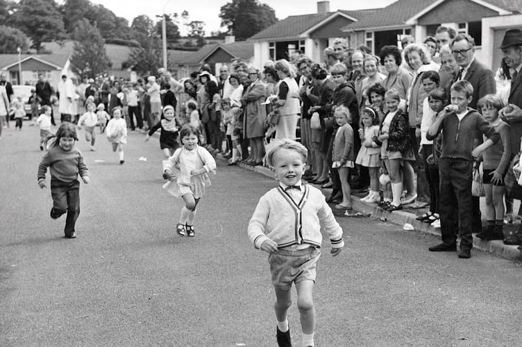 Racing in the streets. Youngsters races during Ogwell Fete from June 1971
