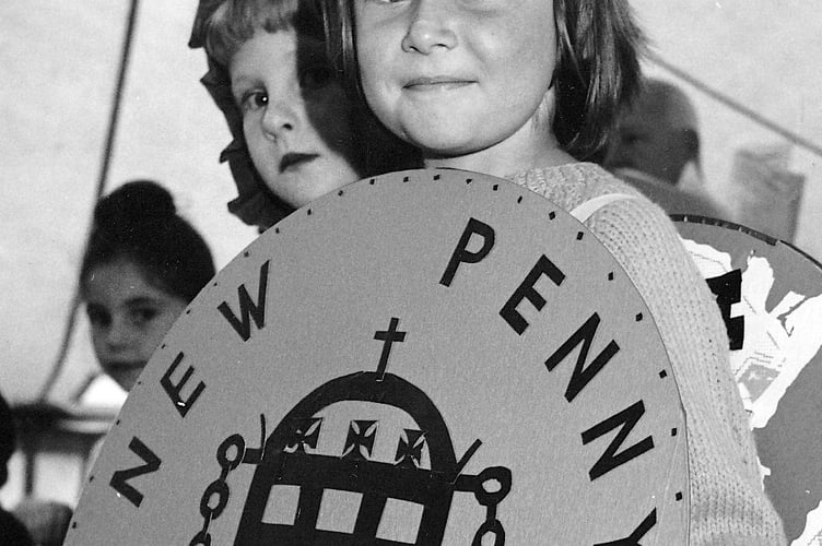 Turning up like a good penny. Elaine Corner from Teignmouth in the town carnival's fancy dress parade from July 1971
