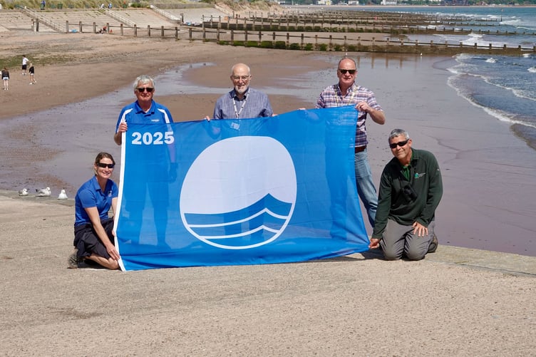 Blue Flag at Dawlish Warren with Mayor of Dawlish Cllr Anthony James, Cllr John Nutley, Teignbridge Council’s Executive Member for Leisure and Recreation with Sarah Holgate - Resort Manager and resort staff. Photo Bob Simpson