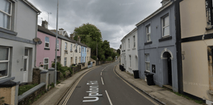 Man charged after body found in flat