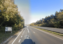 Delays on A38 as vehicle collides with HGVs in lay-by