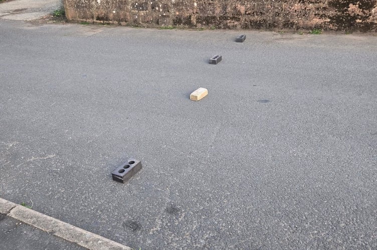 Bricks placed in the road at Milbury Close Exminster. Photo Luke Smith 