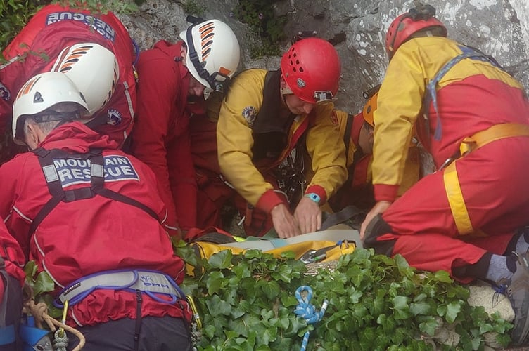 Volunteers from Devon Cave Rescue Organisation and Dartmoor Search and Rescue Ashburton practice working together to rescue a stricken climber.