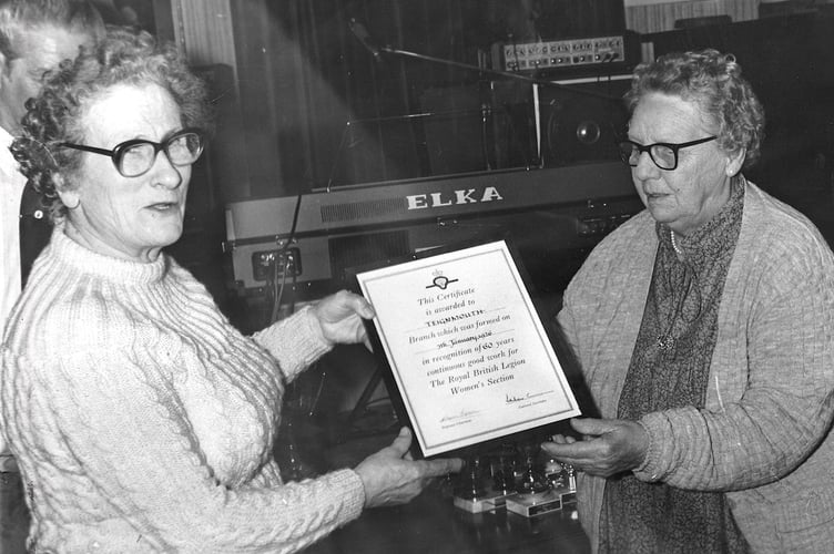 Teignmouth Royal British Legion. Gwen Tidball, chairwoman of the ladies section presents a certificate to Mrs M Millen, president of the ladies section, to commemorate her years of service in April 1986
