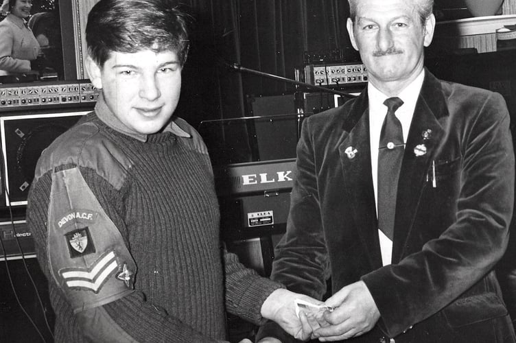 Corporal David Flett from the Army Cadet Force receives a cheque from John Couch of Teignmouth Royal British Legion in 1986