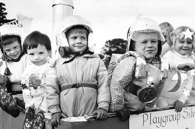 Moretonhampstead Carnival from August 1986. Moretonhampstead Playgroup were circling the world on their float which also celebrated their silver anniversary