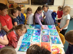 Artist helps children paint stories