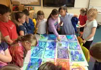 Artist helps children paint stories