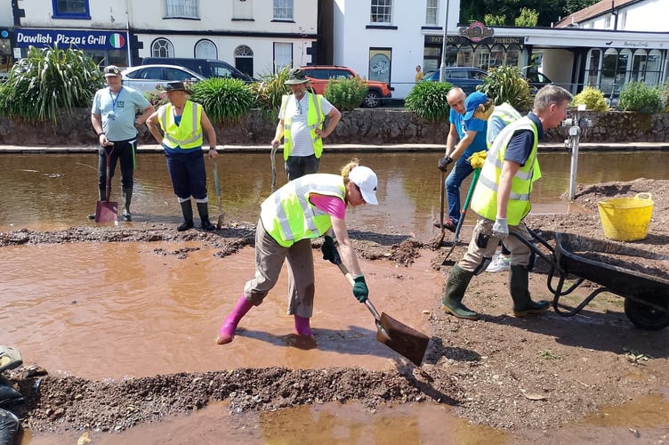 WADE volunteers hard at work clearing sediment in Dawlish. Photo WADE