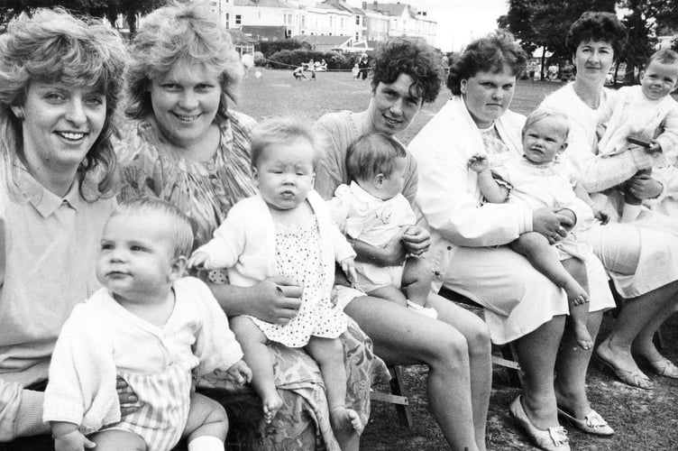 Oh you must have been a beautiful baby... Mums and their offspring in the four to nine months section await judging at Dawlish Carnival from August 1986