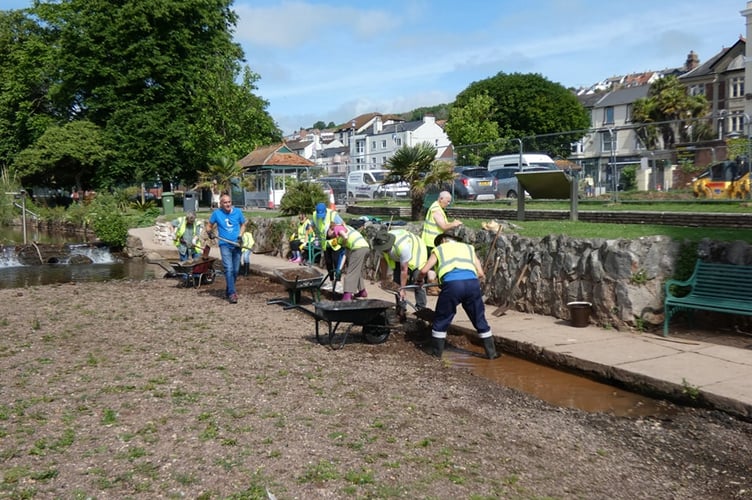 Volunteers working to clear the Brook in Dawlish, Photo WADE