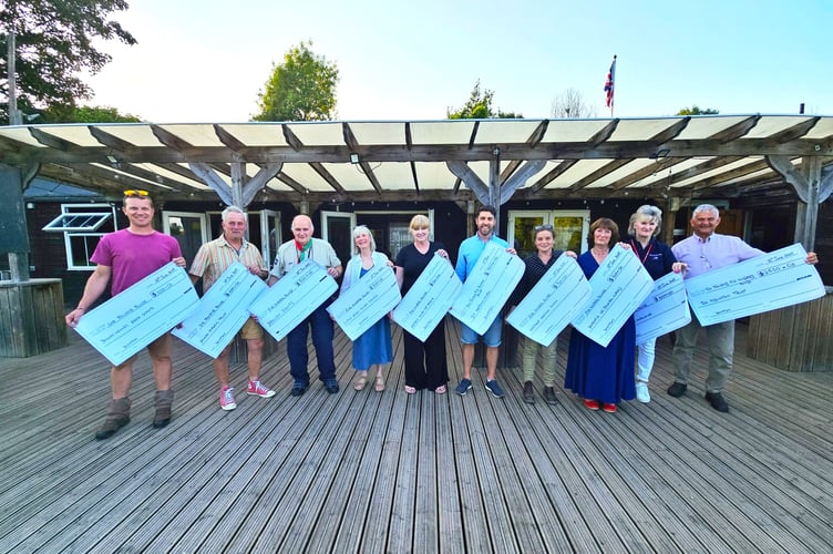 Ten charities benefited from the £9,500 donated by Ashcombe Village Hall last week