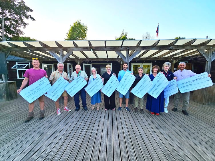 Ten charities benefited from the £9,500 donated by Ashcombe Village Hall last week