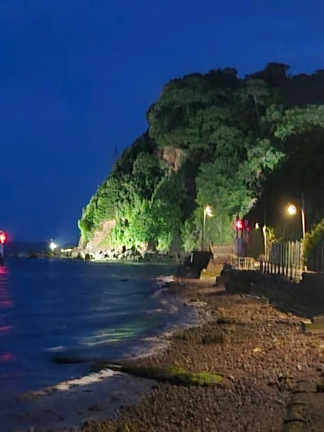 The Ness headland Shaldon lit up in the evening