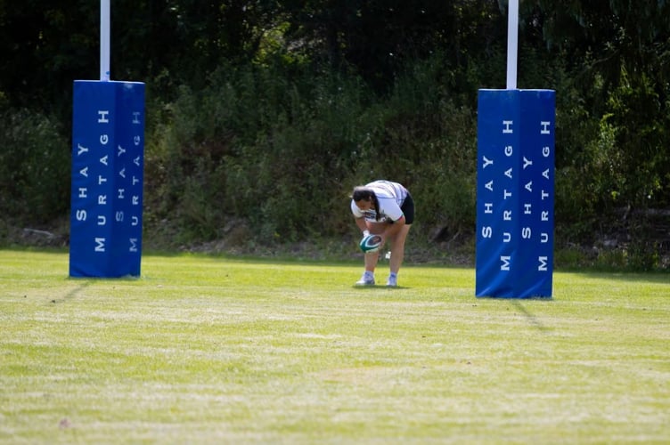Shawna Ball scoring one of her 10 tries in the record breaking game