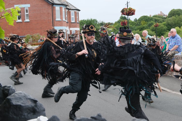 'Like a flock of ragged crows on speed' - the Beltane Border Morris performing at The Anchor Inn in Cockwood (Photo: Mike Alsford.