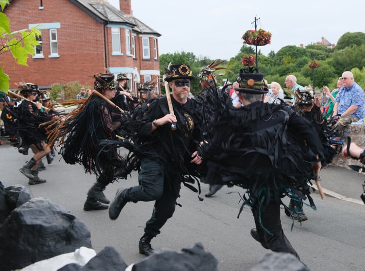 'Like a flock of ragged crows on speed' - the Beltane Border Morris performing at The Anchor Inn in Cockwood (Photo: Mike Alsford.