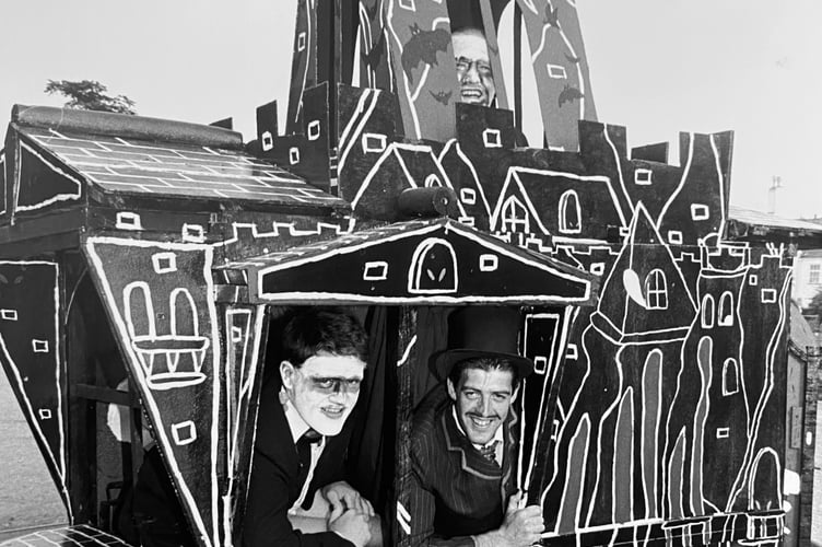Kevin Farley, Andy Holcombe and Martin Farley making up members of The Adams Family at Dawlish Carnival in August 1995