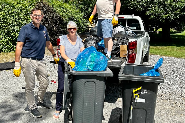 Bovey town clerk Mark Wells with Cllrs Brooke and Evans during the clean-up.