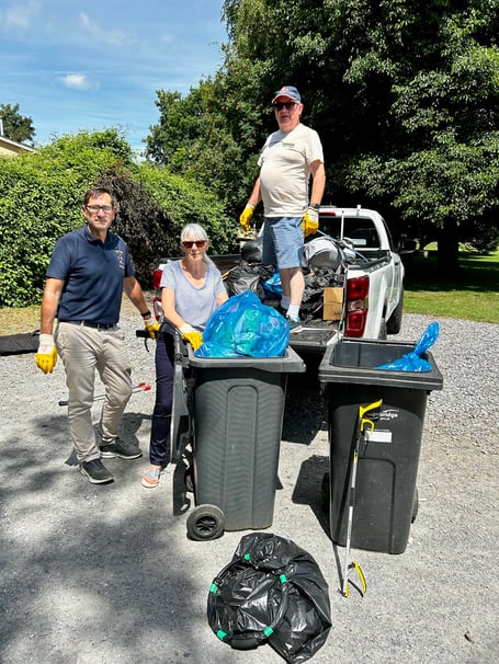 Bovey town clerk Mark Wells with Cllrs Brooke and Evans during the clean-up.