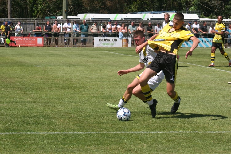 Buckland Athletic vs Torquay United action