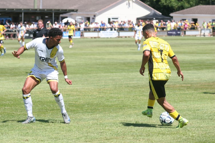 Phil Mendonca on the ball for Buckland Athletic