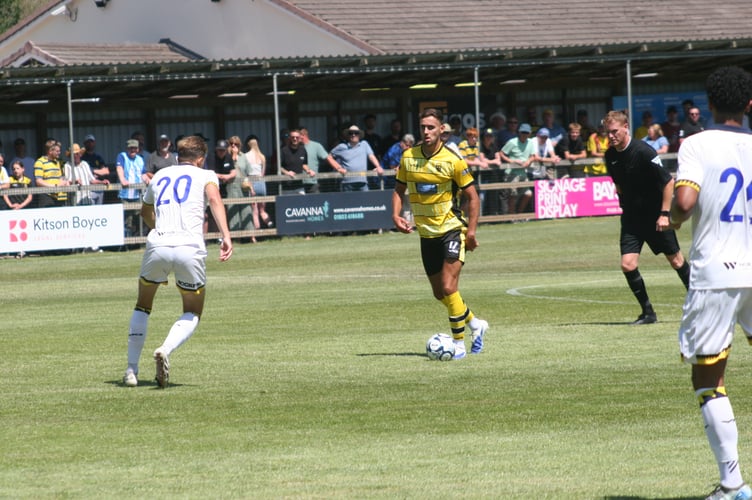 Cameron Sangster on the ball for Buckland Athletic