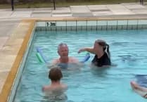 Lifeguards help disabled man to swim with grandkids