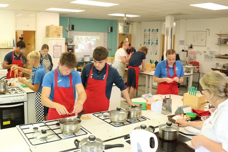 Dawlish students taking part in Jamie Oliver's record-breaking cookery class
