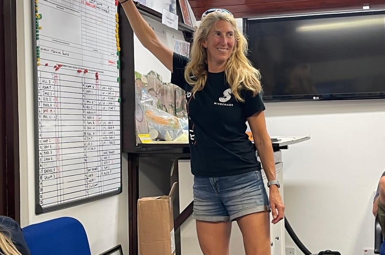 Rachel Palmer reaches for the bell to mark the completion of her Tier 2 training. Photo: Amy Furlong