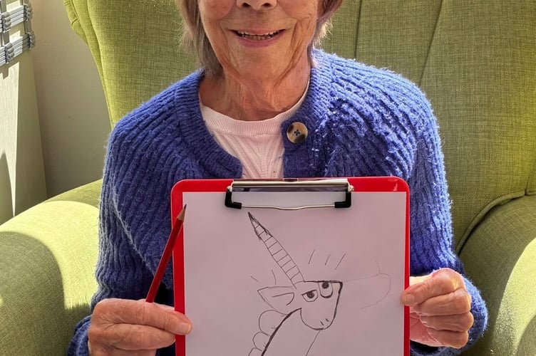 Mulberry House resident Shirley Manley with her interpretation of the Grumpycorn