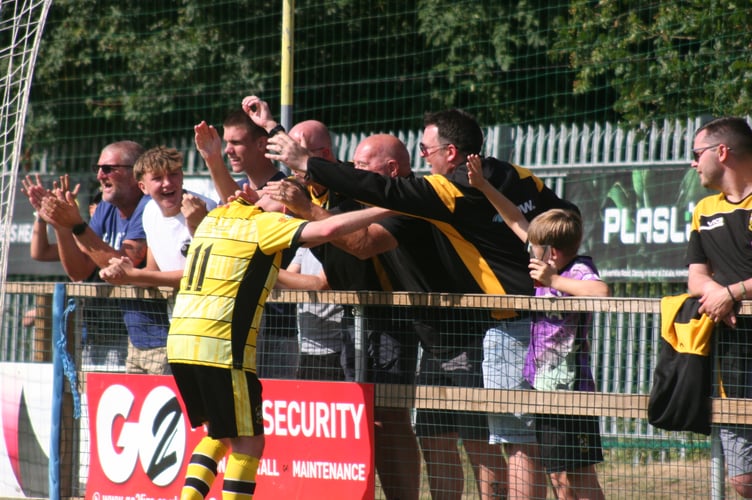 Buckland winger Luke Forward shares his celebrations with supporters