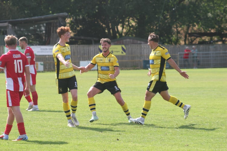 Buckland players celebrate a Sean Thomson stunner