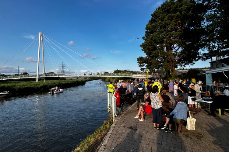 Crowds were gathered at Newton Abbot Quay to cheer the rowers across the fishing line. Photo: Nigel Canham