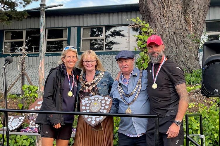 Barham Cup Mixed Singles winners Rachel Palmer and Andy Parfitt receive their award from Teignmouth mayor councillor Cate Williams and Newton Abbot mayor councillor Colin Parker