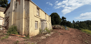 Plan to build homes on fire-ravaged manor house site 