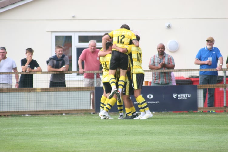 Buckland celebrating Ryan Bush's goal vs Wellington
