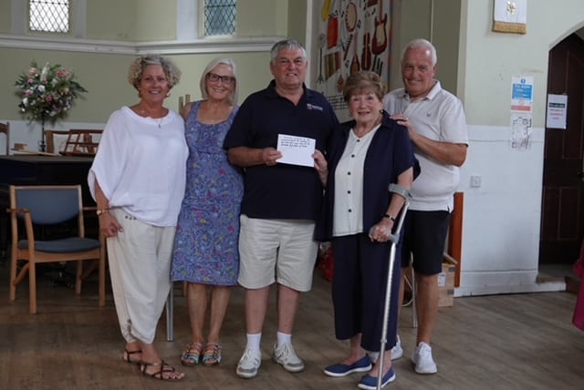 Waterfowl warden Don Phillips receives a cheque from organiser of the Over 60s Disco Carole Tamlyn accompanied by the Disco team, DJ Steve Jessup and Sharon Jessup with  Linda Marsh.  Photo Bob Simpson 