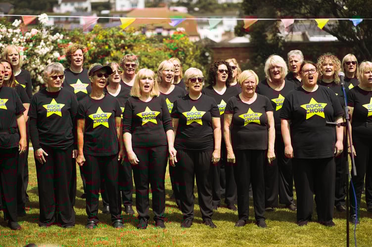 Rock Choir performing at Sefton Hall's 20th anniversary party                