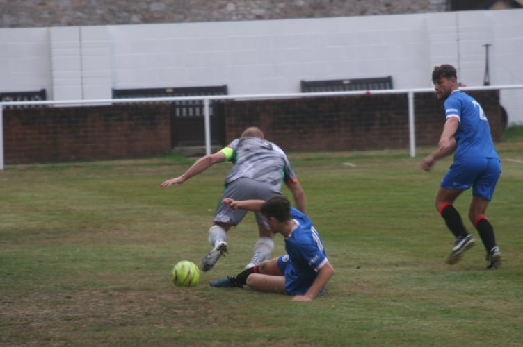 Tom Lobb with a perfect sliding challenge for Newton Abbot Spurs