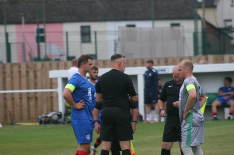 Spurs skipper Lewis Breslan and Bovey captain Lewis Perring