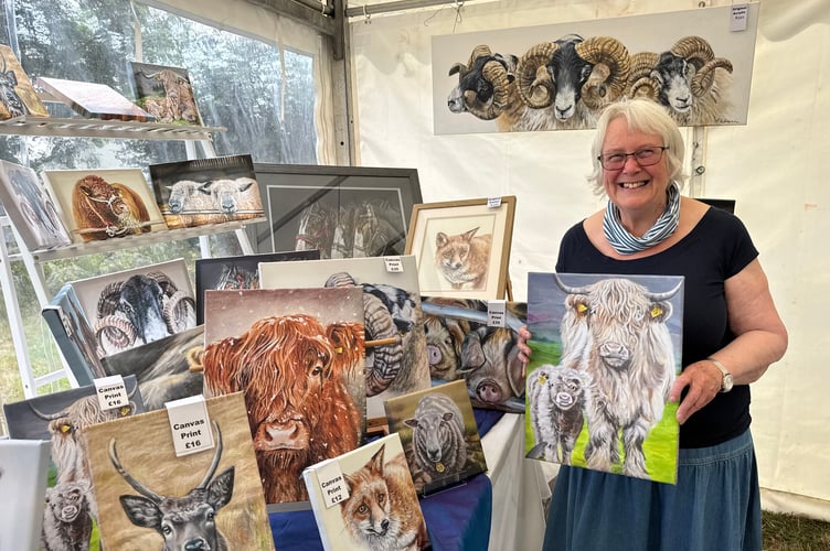 Janet Jarvis, animal artist, from North Tawton, works in pastels and acrylics and enjoys painting farm animals, wildlife and pets. She had a stand with some of her work on sale at Chagford Show.  AQ 1003
