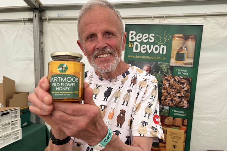 Peter Hunt of Blackaller Bees, North Bovey, Newton Abbot sold Dartmoor Wild Flower Honey at Chagford Show.  AQ 1075
