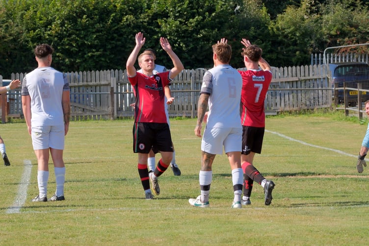Ollie Aplin celebrates giving Bovey Tracey AFC the lead.