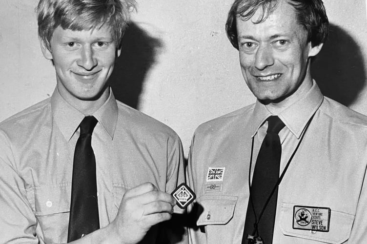 Tim Borling from Chudleigh receives the Queen's Scout Award from the Devon County Assistant Commissioner for Venture Scouts Steve Wilson in June 1986