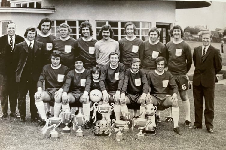 Gerry Turner and his 1972/73 Dawlish Football team with their many trophies.