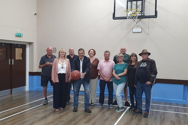 Newton Abbot MP Martin Wrigley and Teignmouth mayor councillor Cate Williams with volunteers who helped refurbish the Richard Newton Hall
