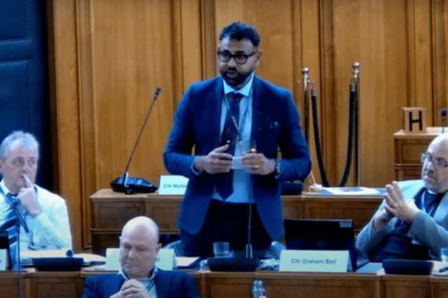 Councillor Syed Jusef, who proposed a motion on hate crime, addressing County Hall