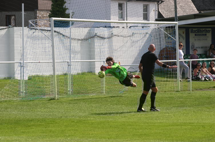 Axminster goalkeeper denying Spurs' Pullman from the penalty spot