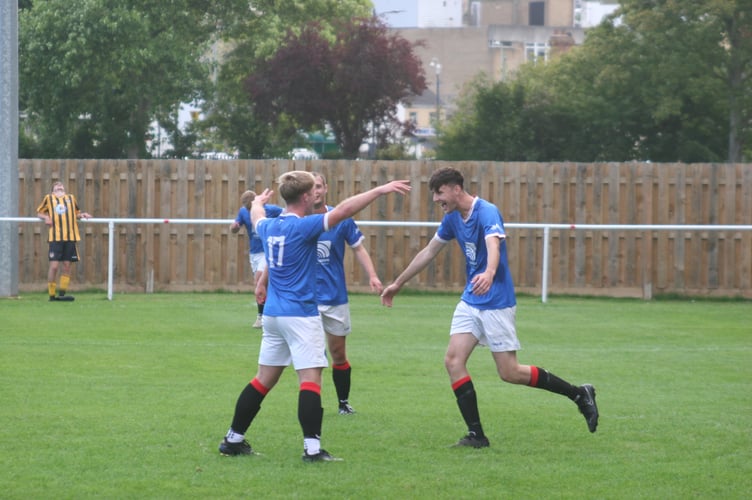 Finn Pearse (right) celebrates scoring the seventh and final Spurs goal 